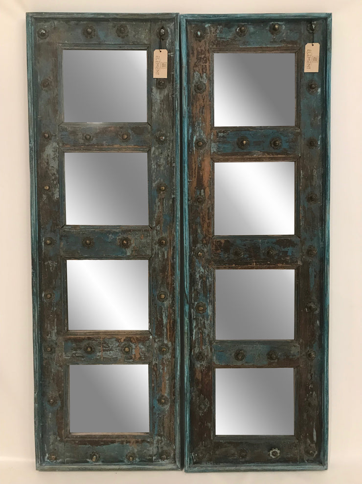 Blue Wooden Door with Four Mirrors